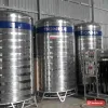 Dãy bồn inox đứng Sơn Hà cỡ lớn có chân đế, băng chữ SONHA trên thân, đặt trong nhà xưởng (ảnh minh hoạ dòng hàng)