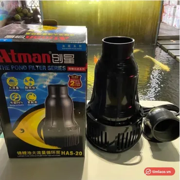 Máy bơm hồ cá Koi Atman HAS-20 đặt cạnh hộp máy ghi mã HAS-20